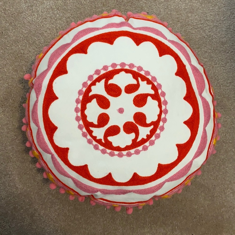 colorful round pillow. small spot on back